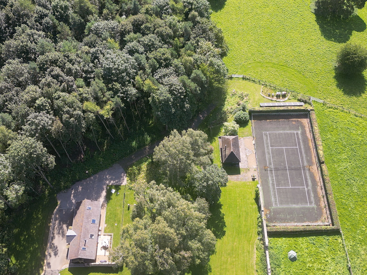 Aerial view showing The Old Workshop within its wider landscape