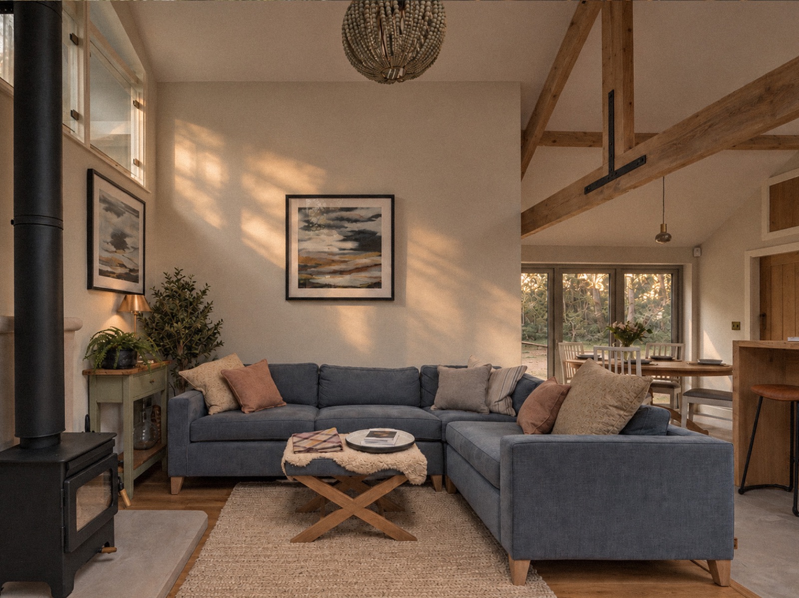 The Old Workshop living space, with warm light across timber and furnishings